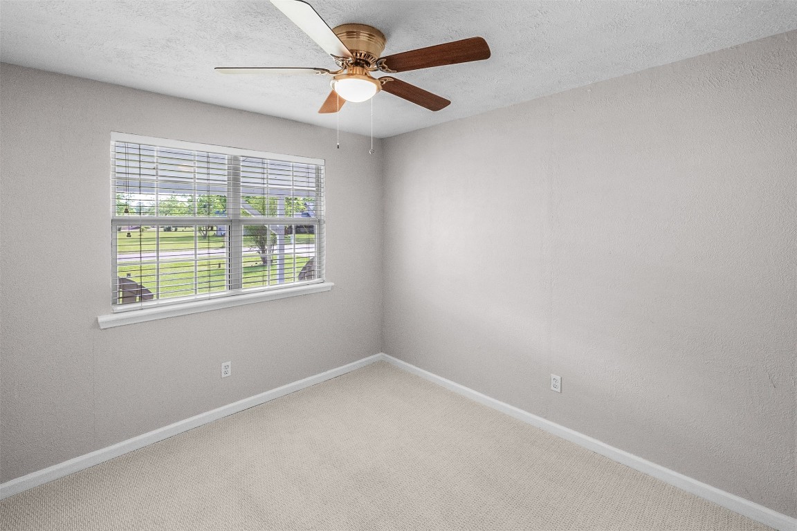 16766 Lake Circle Conroe, TX 77302 - Photo 15 of 22 an empty room with a window