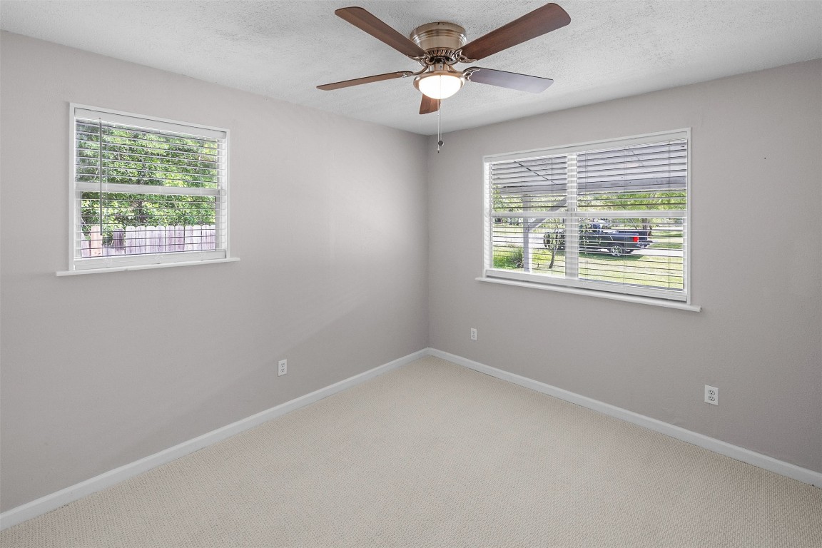 16766 Lake Circle Conroe, TX 77302 - Photo 19 of 22 a view of an empty room with a window