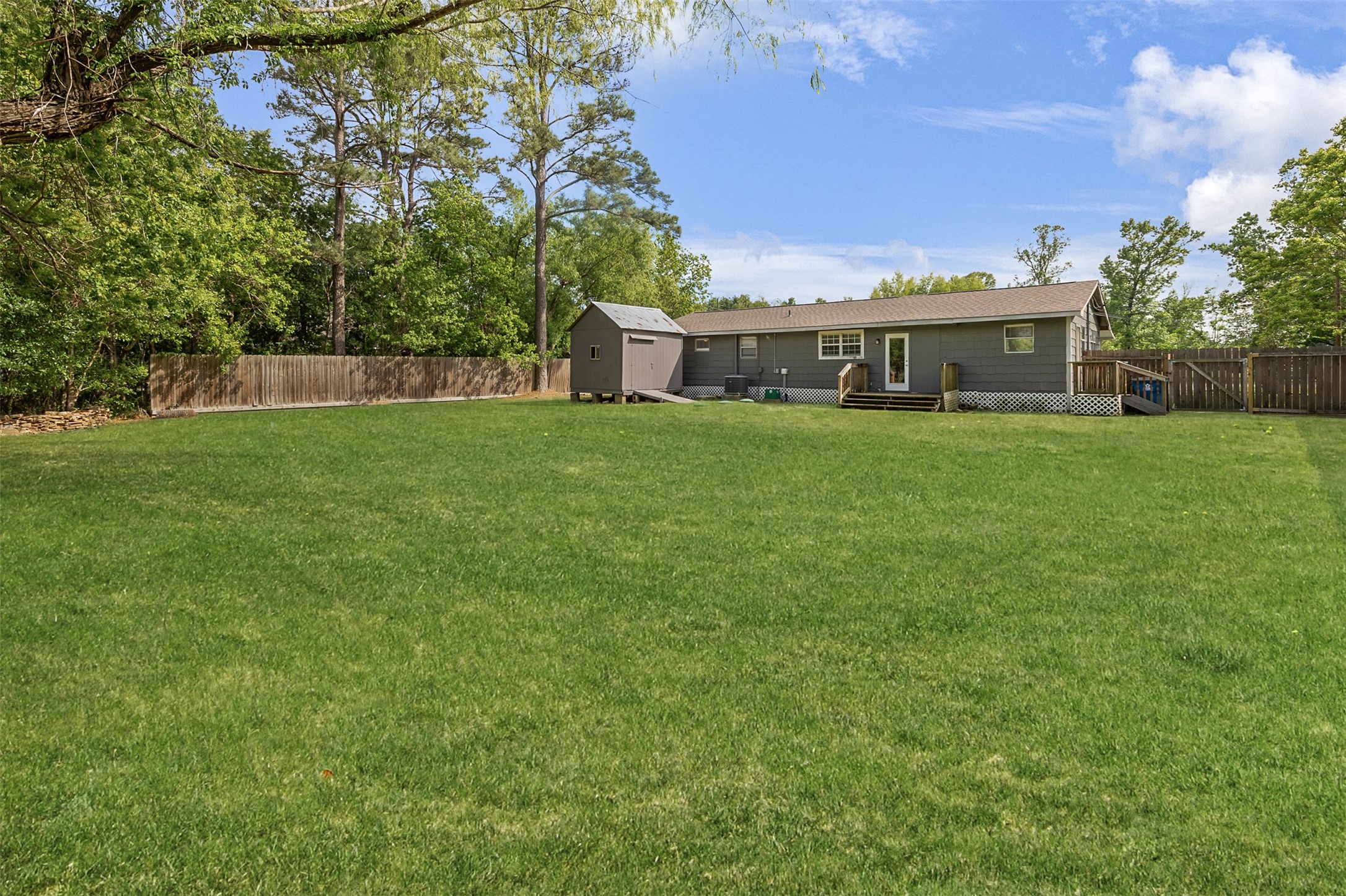 16766 Lake Circle Conroe, TX 77302 - Photo 20 of 22 a front view of a house with a garden