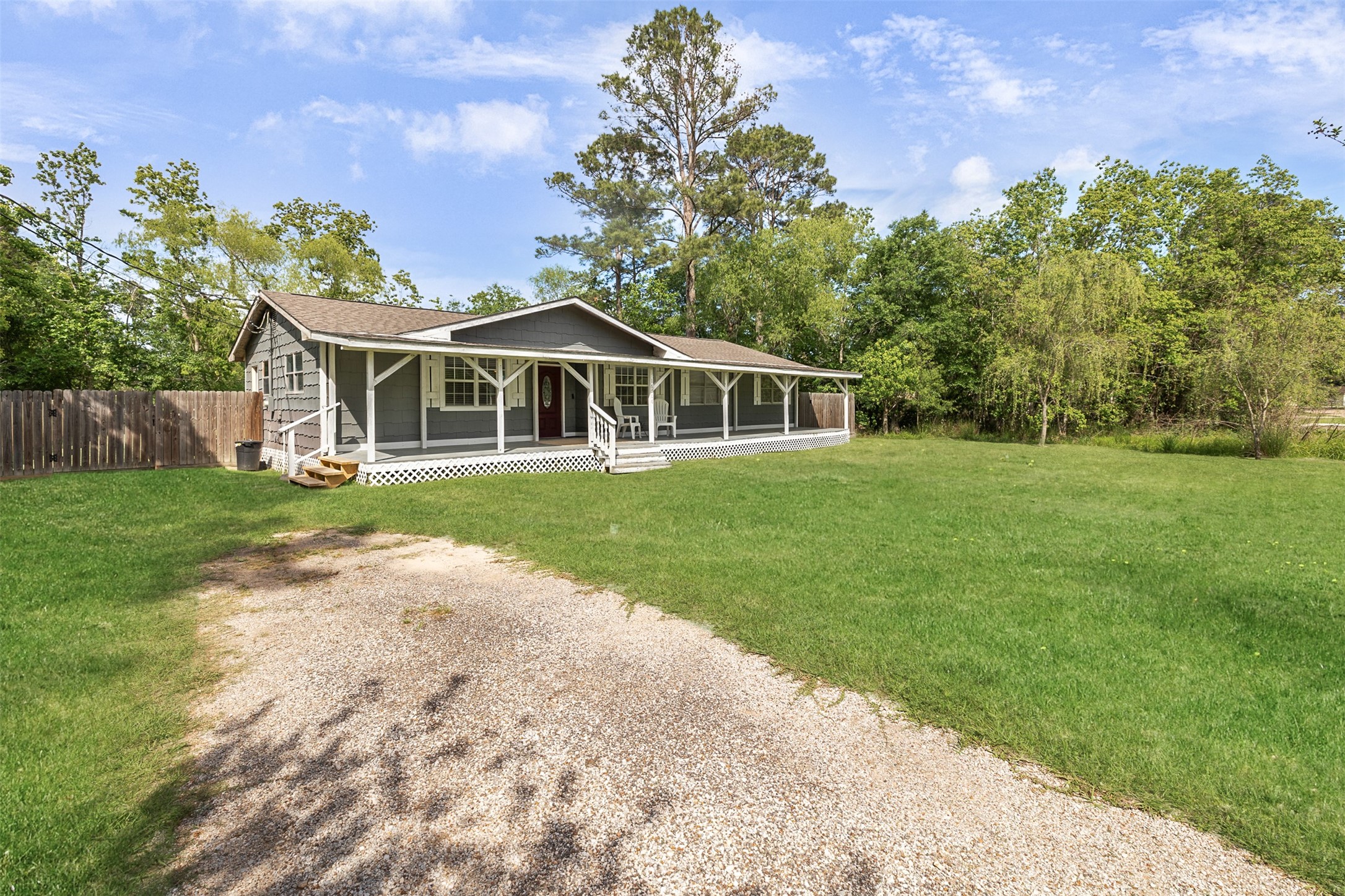 16766 Lake Circle Conroe, TX 77302 - Photo 2 of 22 a view of a house with a yard