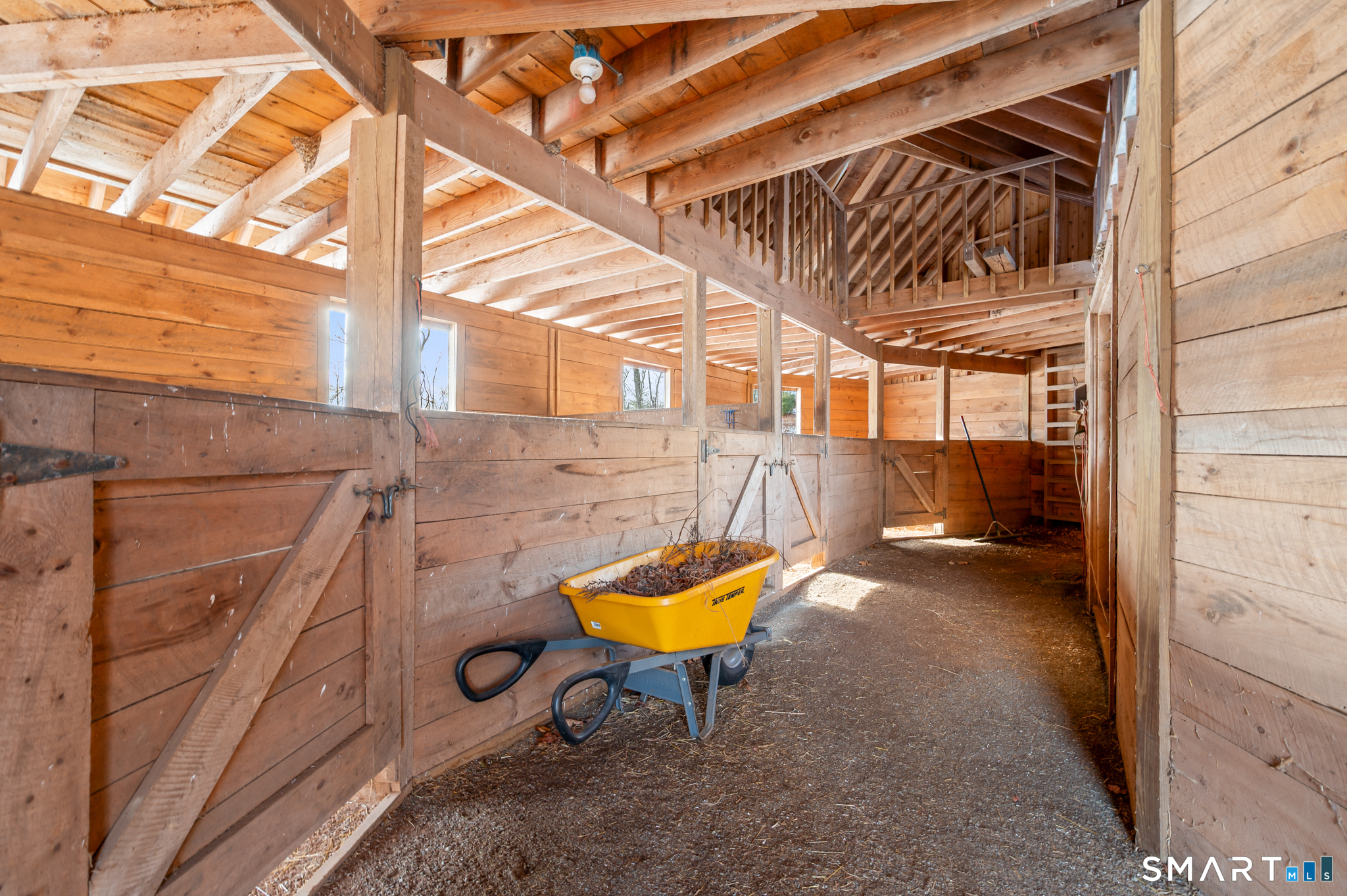 180 River Road Hamden, CT 06518 - Photo 3 of 28 Interior of Barn with Hay Loft - Direct Access to Fenced Paddock