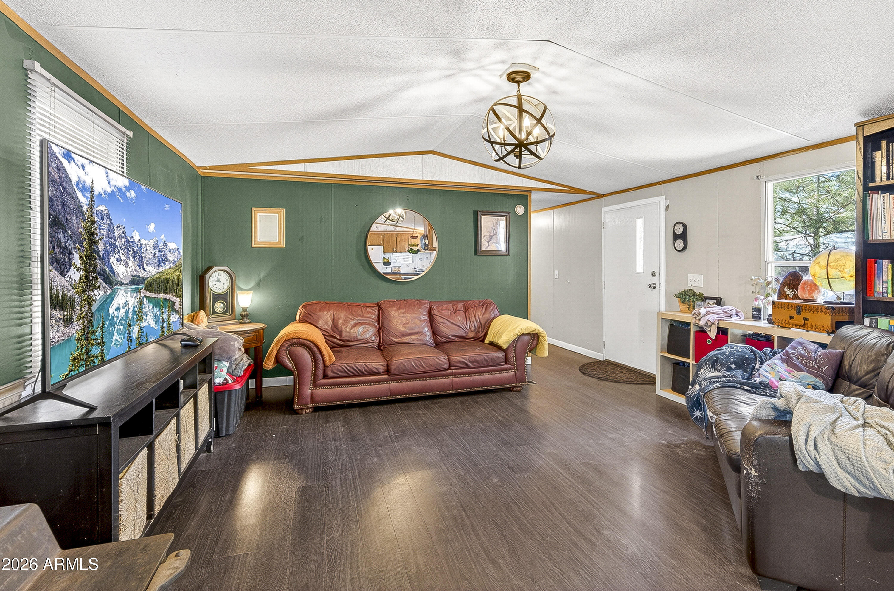 93 Erickson Street Parks, AZ 86005 - Photo 24 of 32 a living room with furniture and a wooden floor