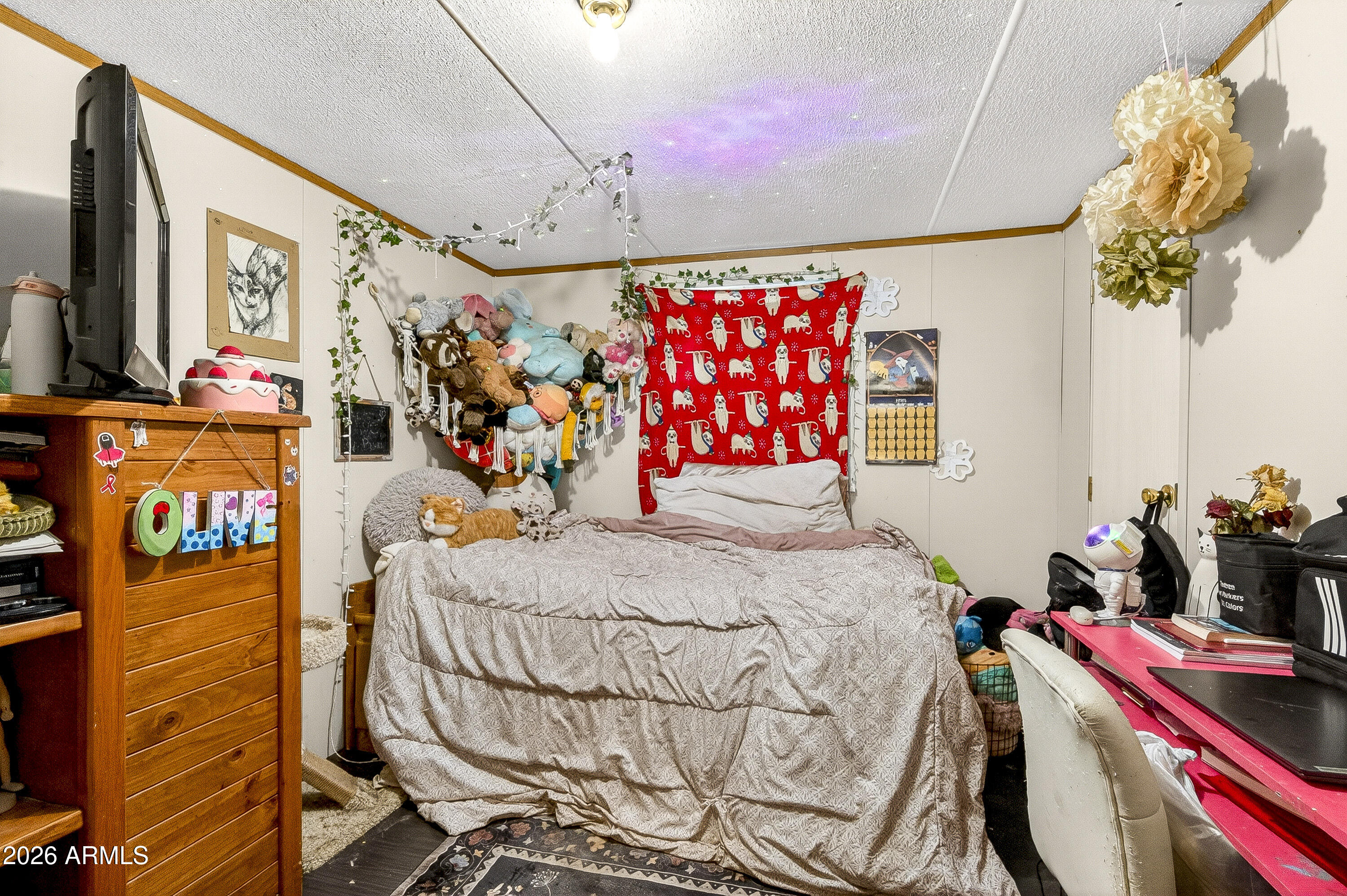 93 Erickson Street Parks, AZ 86005 - Photo 28 of 32 a bedroom with a bed and a window