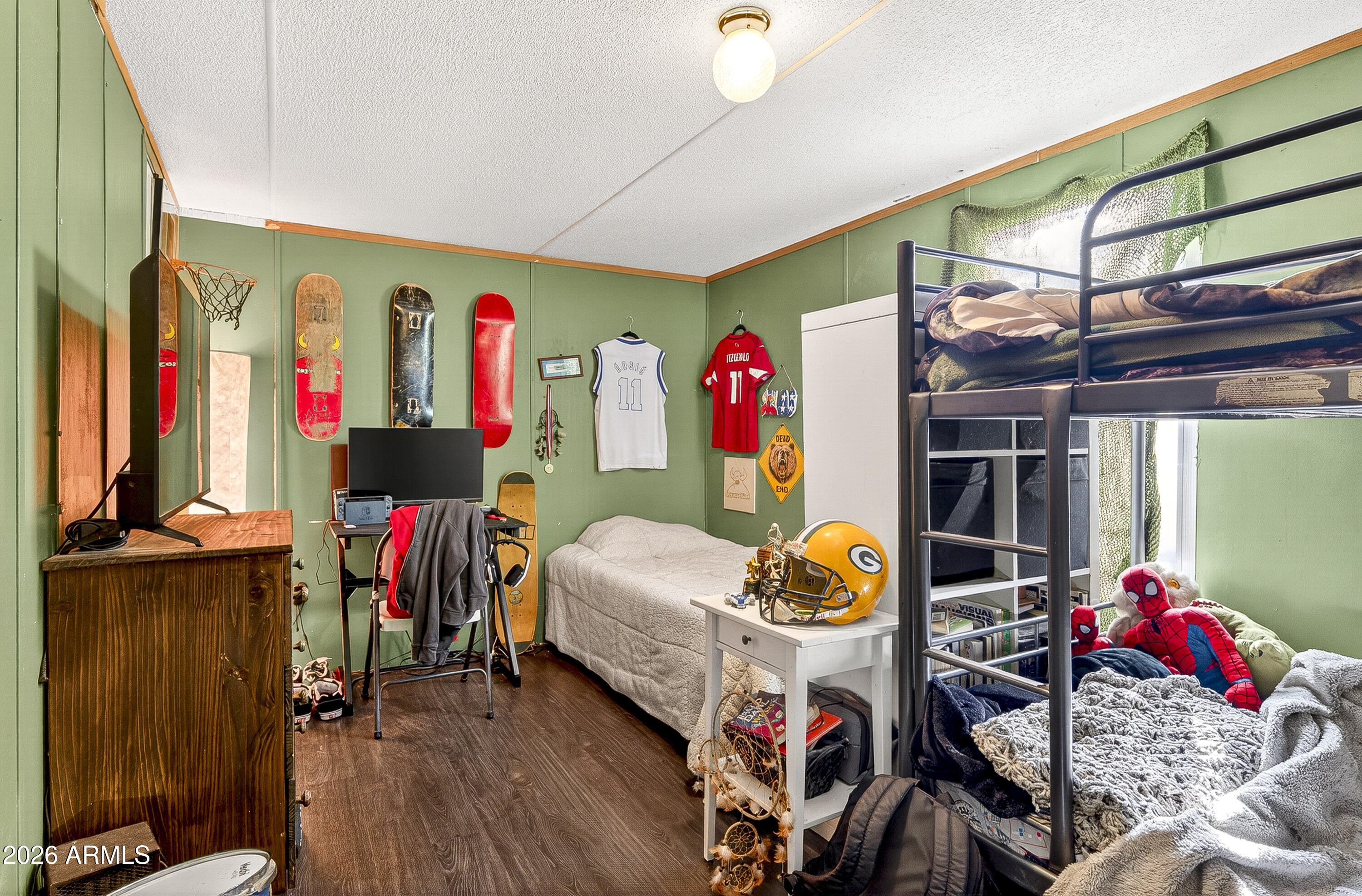93 Erickson Street Parks, AZ 86005 - Photo 29 of 32 a very nice looking room with wooden floor and windows