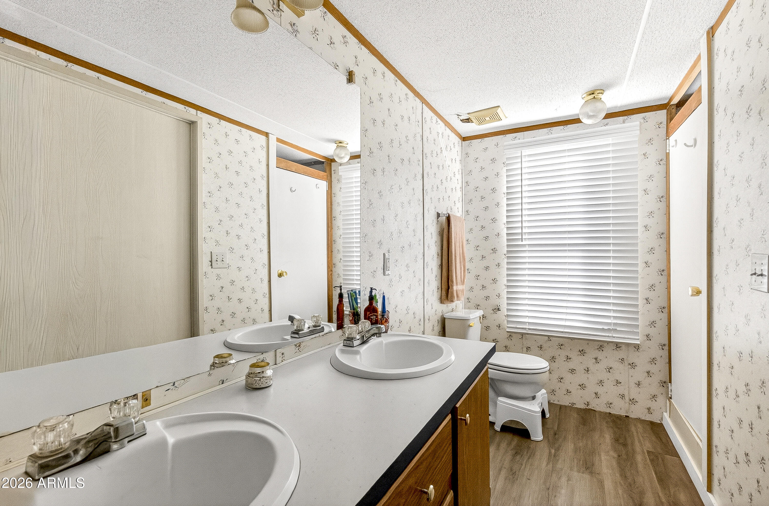 93 Erickson Street Parks, AZ 86005 - Photo 31 of 32 a bathroom with a sink double vanity and a mirror