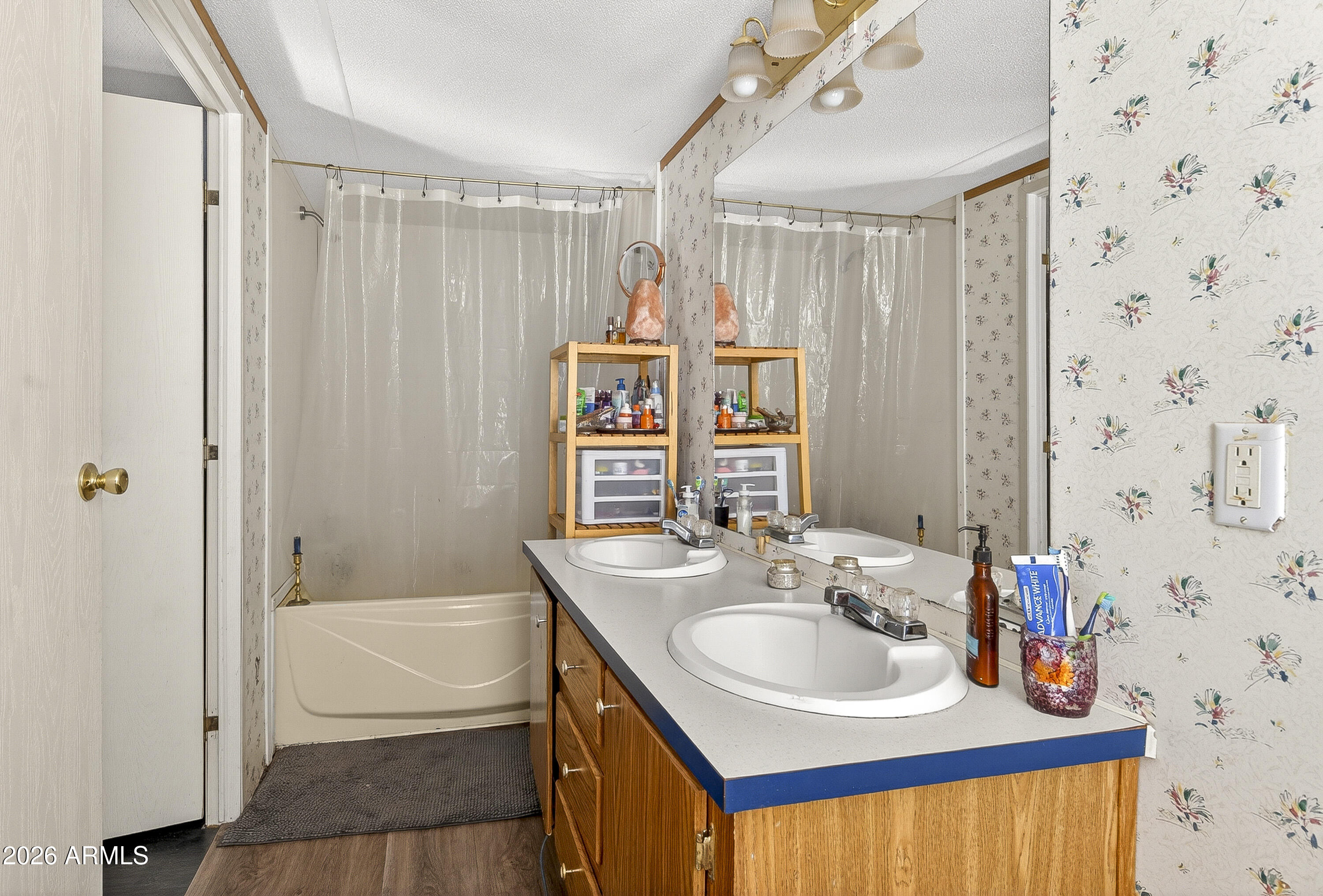 93 Erickson Street Parks, AZ 86005 - Photo 32 of 32 a bathroom with a sink double vanity and a bathtub