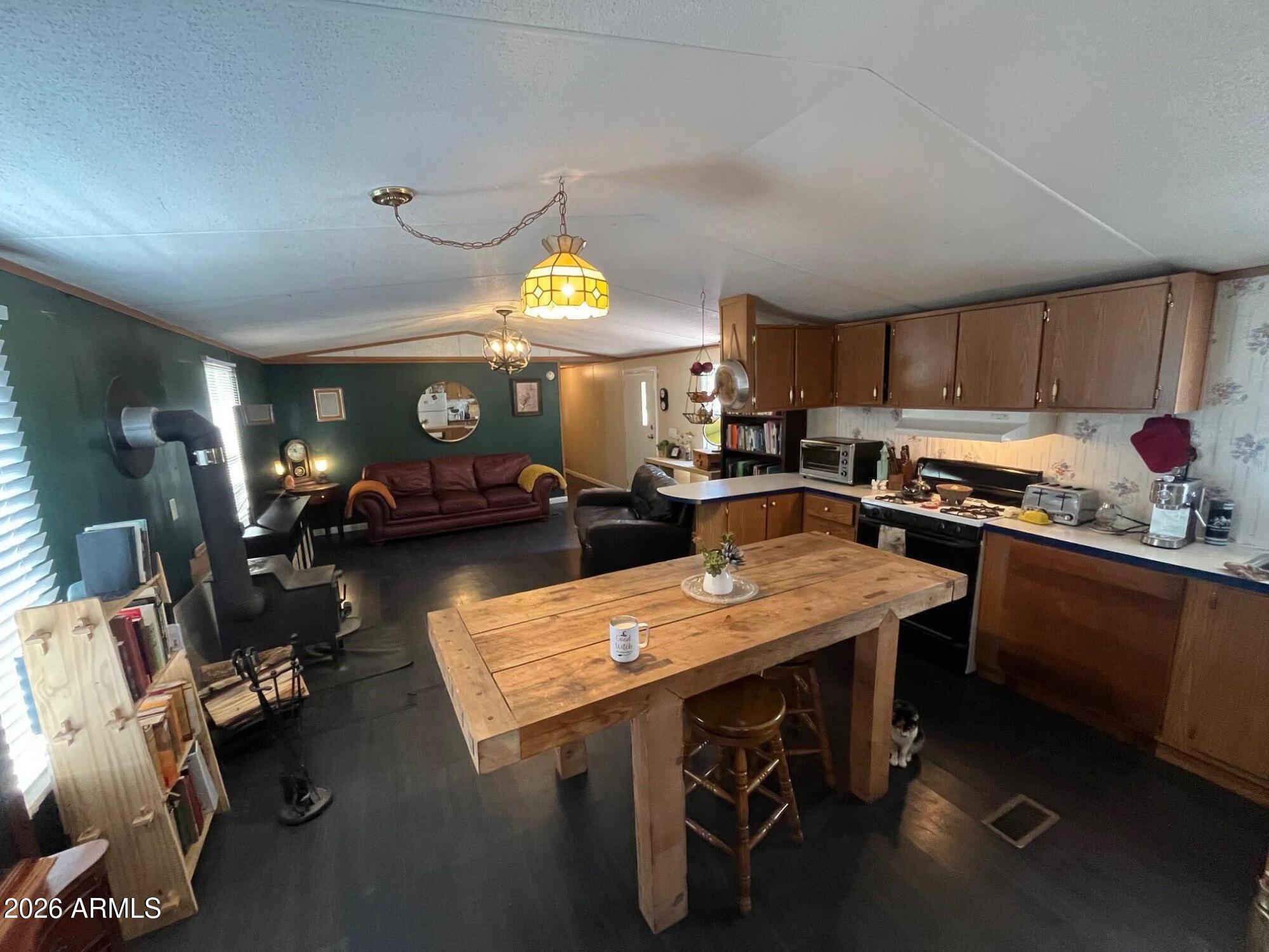 93 Erickson Street Parks, AZ 86005 - Photo 6 of 32 a kitchen with a sink appliances and cabinets