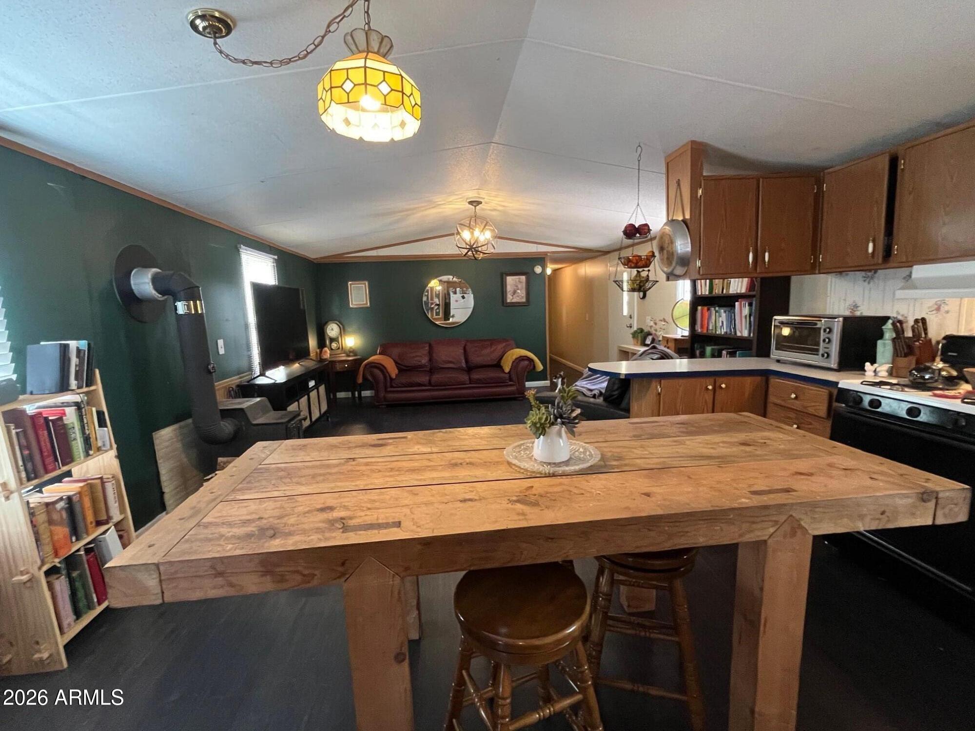 93 Erickson Street Parks, AZ 86005 - Photo 7 of 32 a kitchen with a table and chairs in it