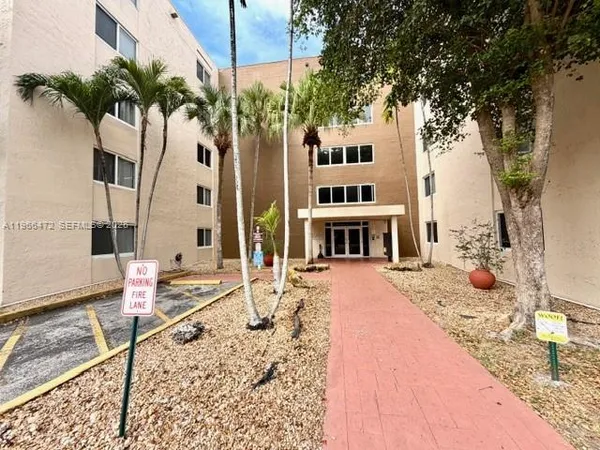 a building with trees in front of it