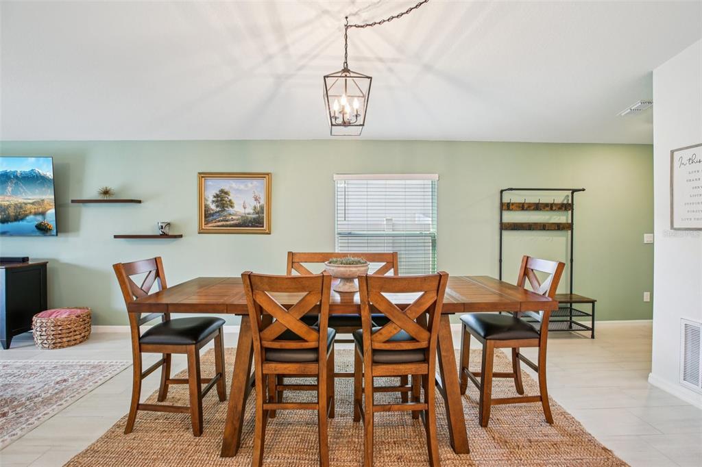 22162 Nebula Way Land O Lakes, FL 34637 - Photo 11 of 44 a view of a dining room with furniture