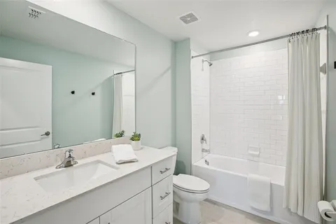 a view of storage and utility room with washer and dryer
