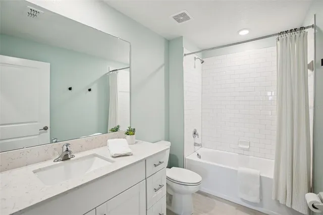 a view of storage and utility room with washer and dryer