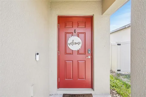 a large kitchen with a table and chairs