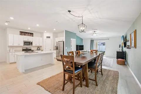 a kitchen with stainless steel appliances a refrigerator stove microwave and sink