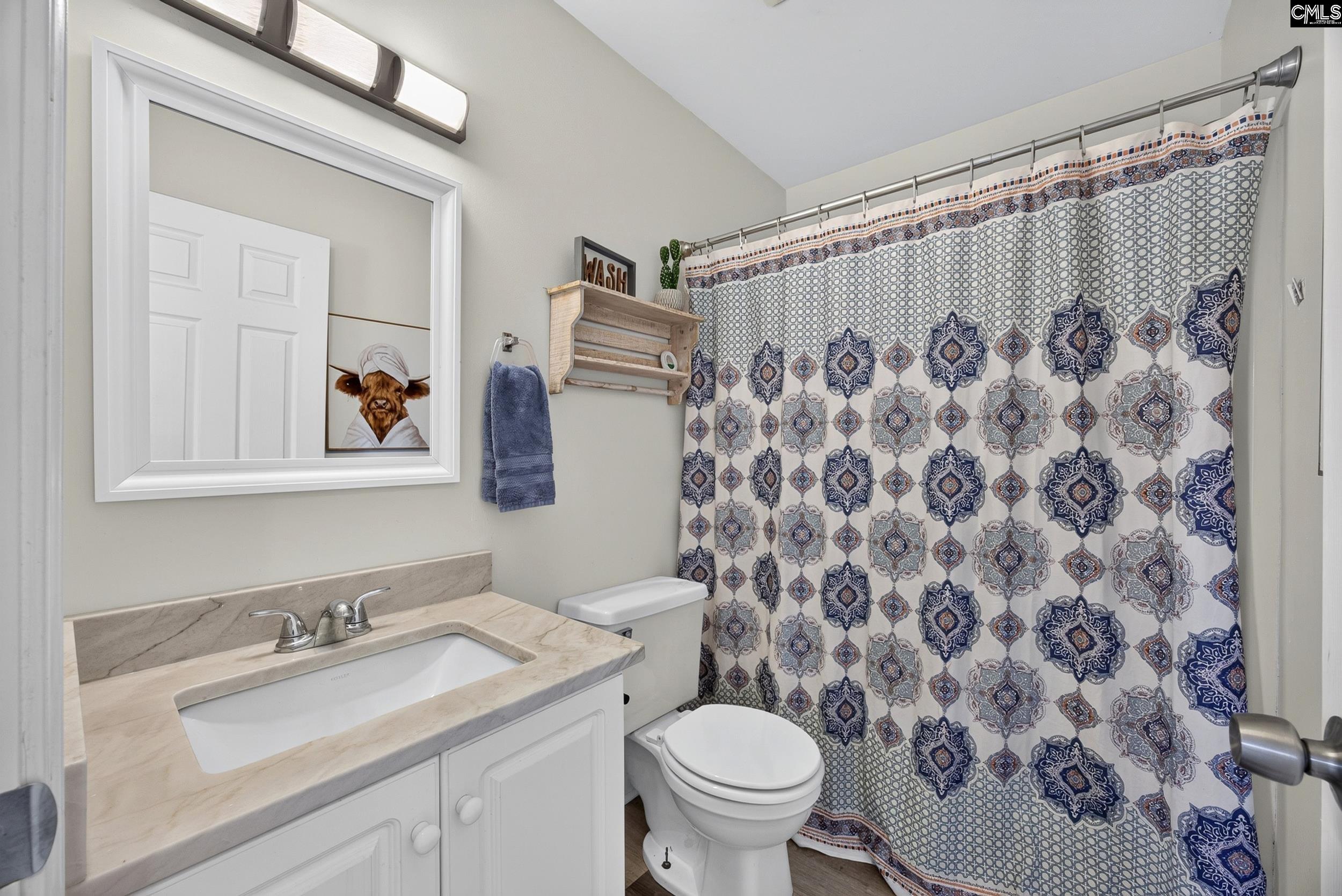 407 Sesqui Trail Columbia, SC 29223 - Photo 26 of 34 a bathroom with a granite countertop sink and a mirror