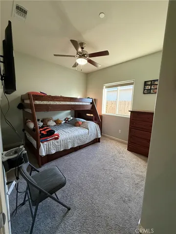 a bedroom with furniture and a chandelier