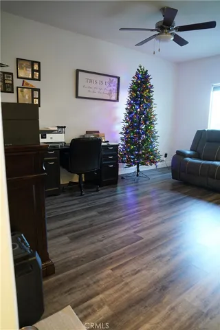 a living room with furniture window and wooden floor