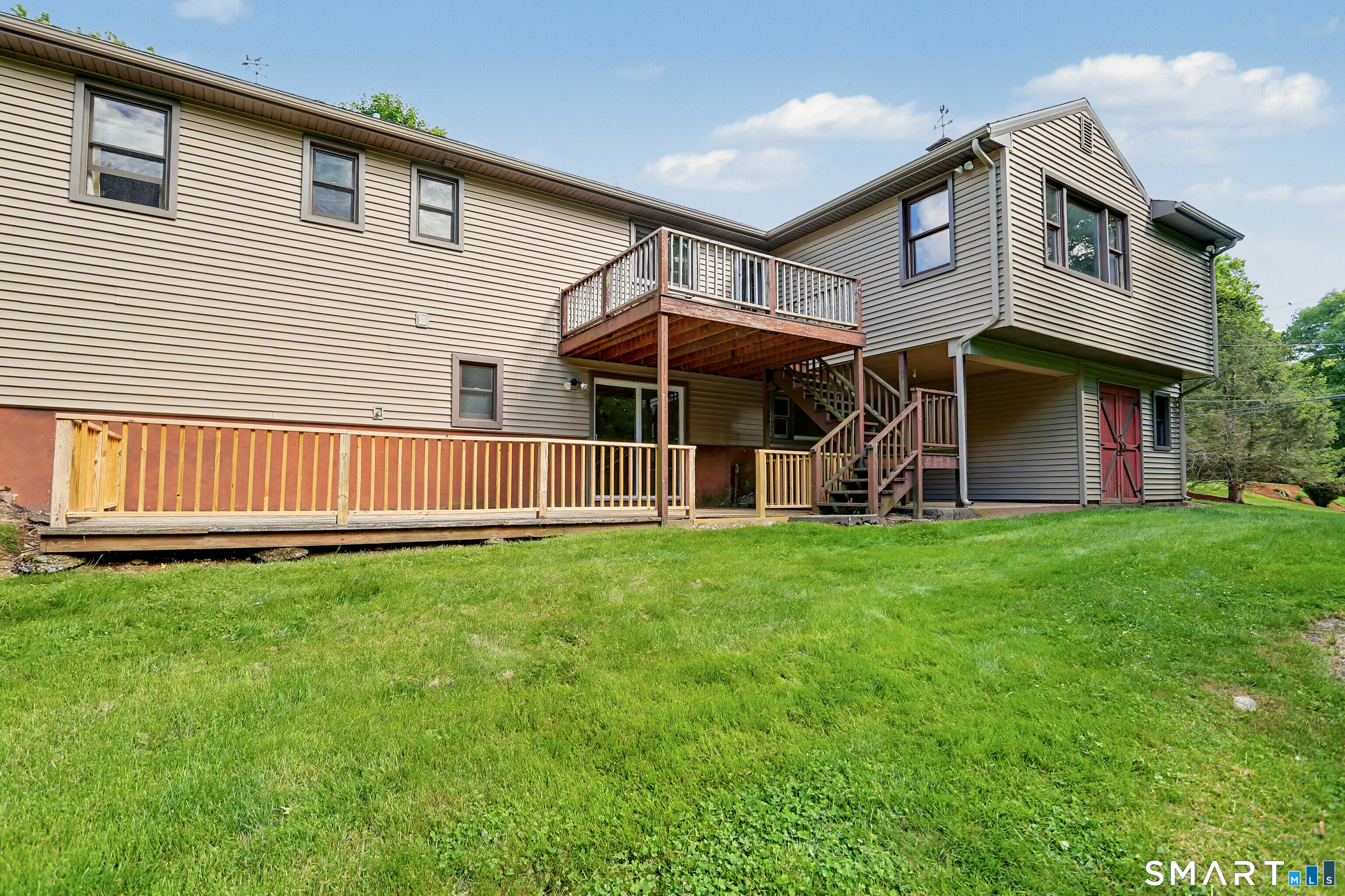 632 Wheelers Farm Road Orange, CT 06477 - Photo 32 of 39 a view of a house with a yard