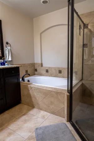 a bedroom with a bed and a desk