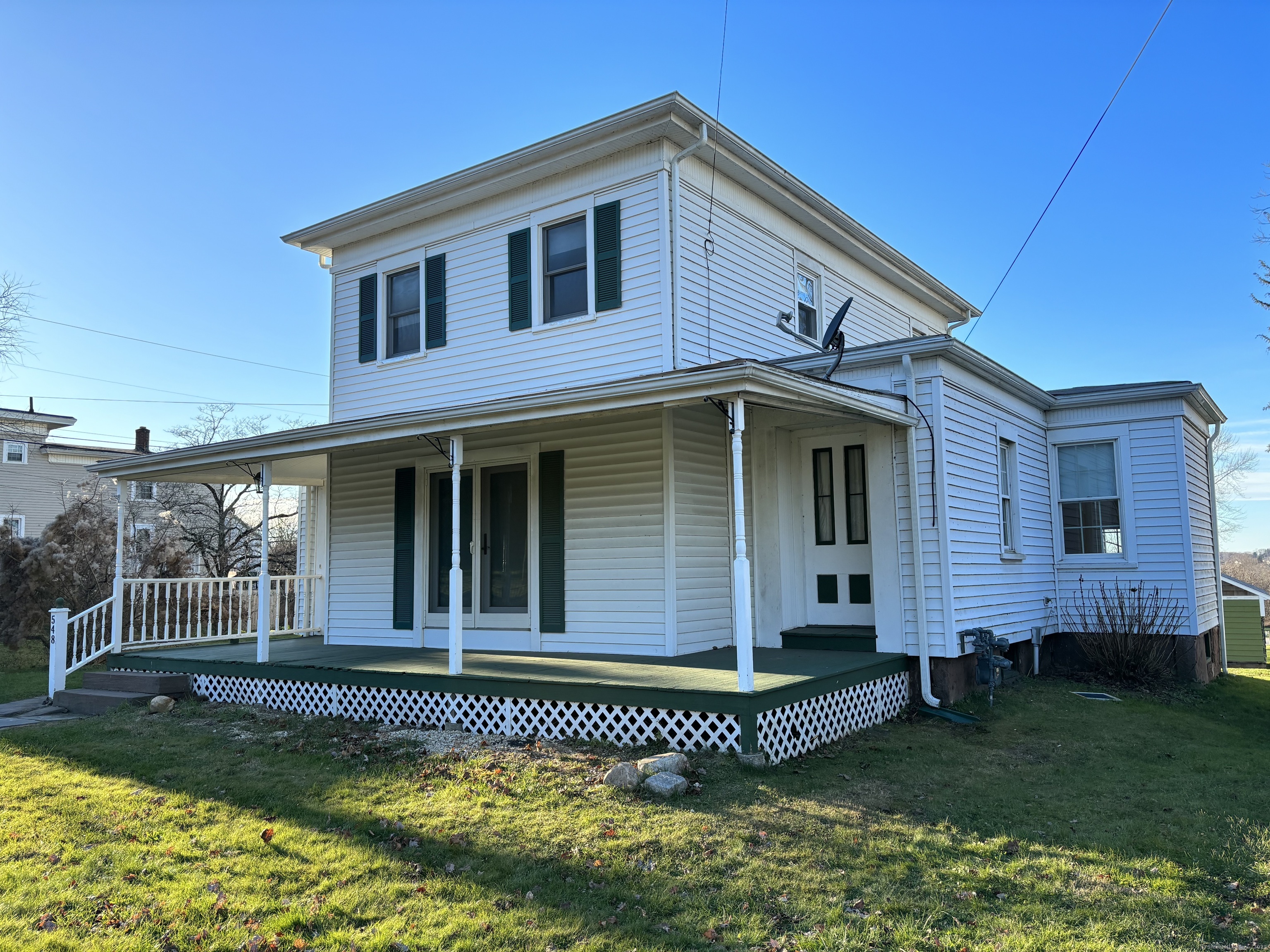 548 Main Street Portland, CT 06480 - Photo 1 of 14 a front view of a house with a garden
