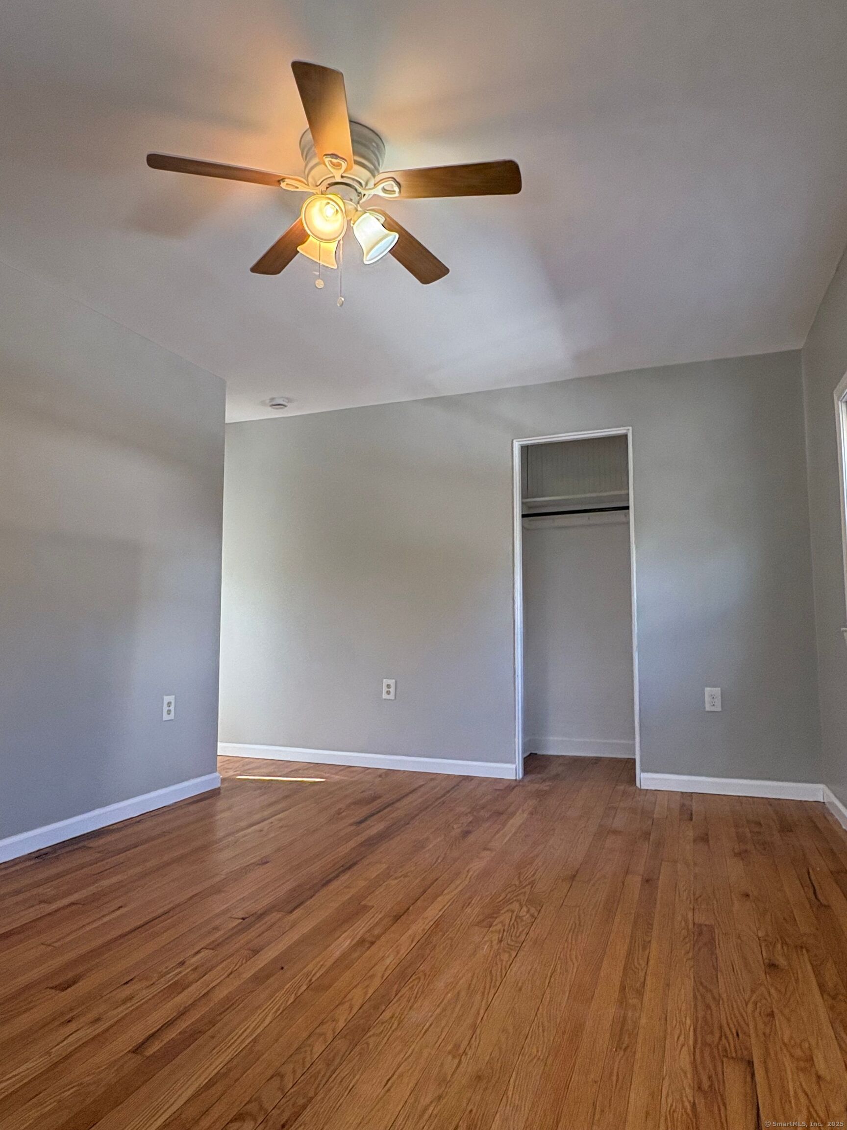 548 Main Street Portland, CT 06480 - Photo 11 of 14 a view of an empty room with wooden floor