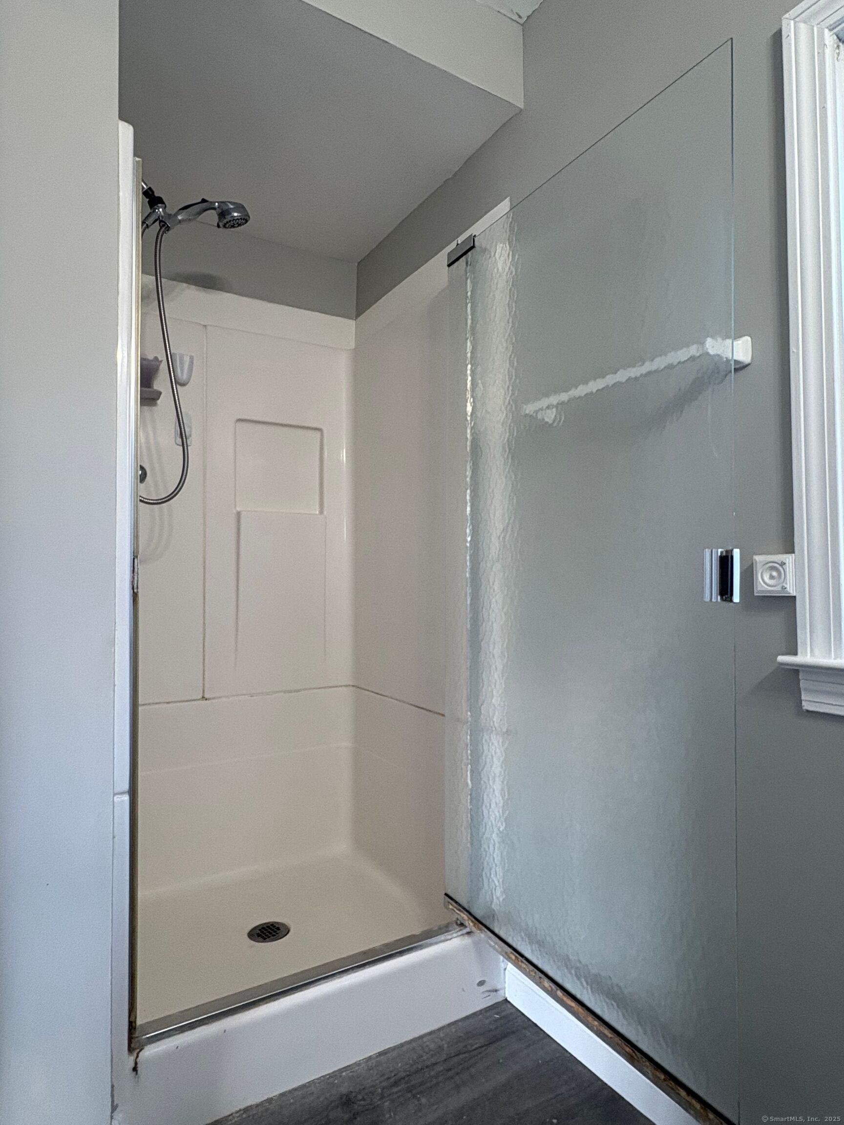 548 Main Street Portland, CT 06480 - Photo 13 of 14 a bathroom with a glass shower door