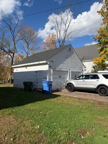 a view of a house with a back yard