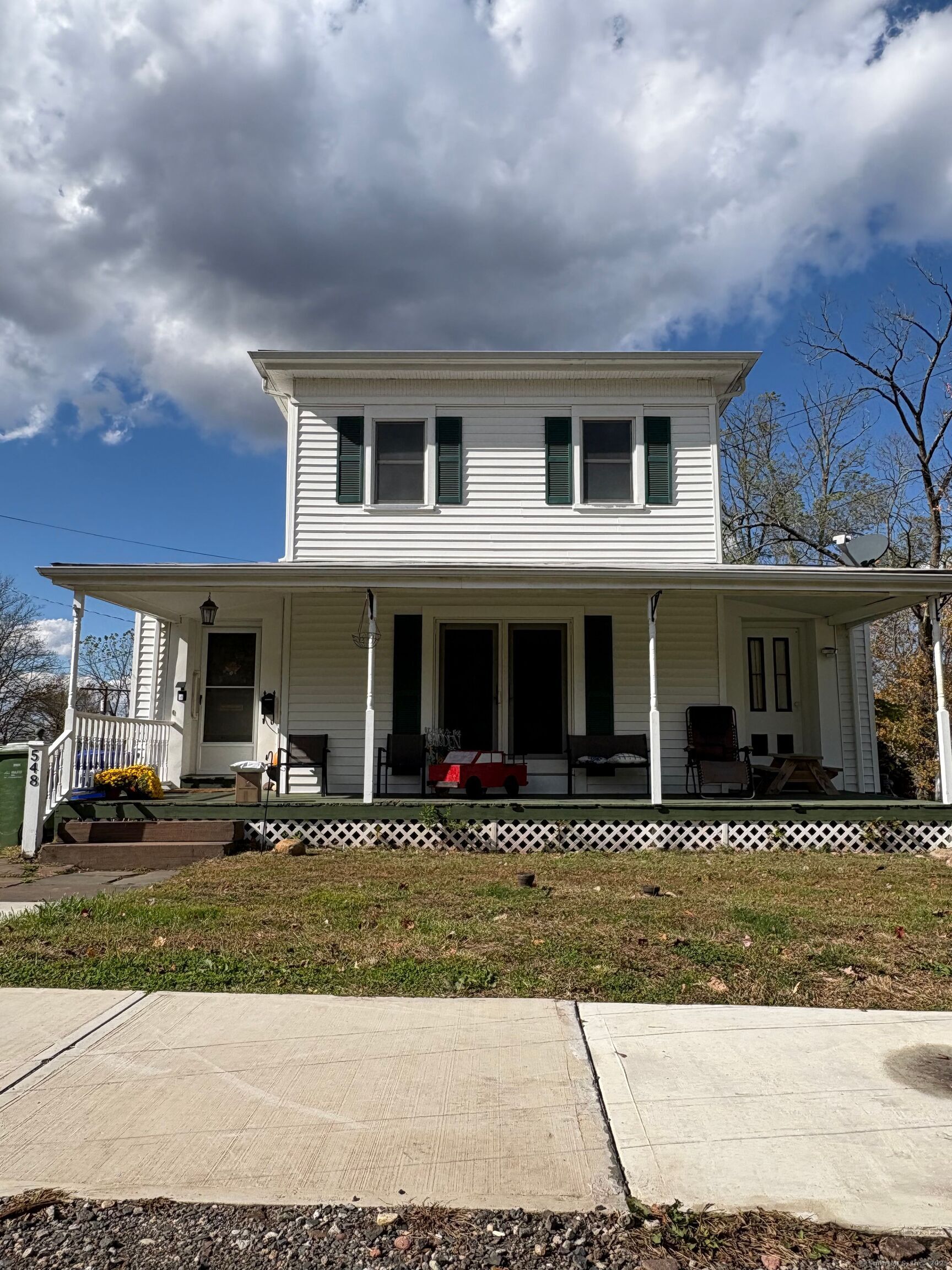 548 Main Street Portland, CT 06480 - Photo 2 of 14 a front view of a house with lots of windows and garage