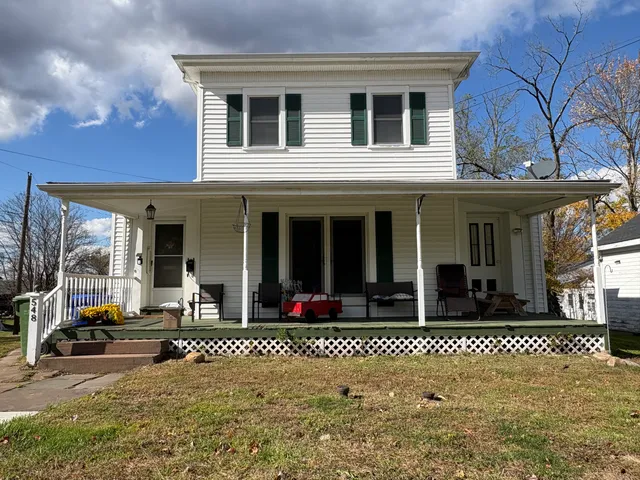 a front view of a house with a outdoor space