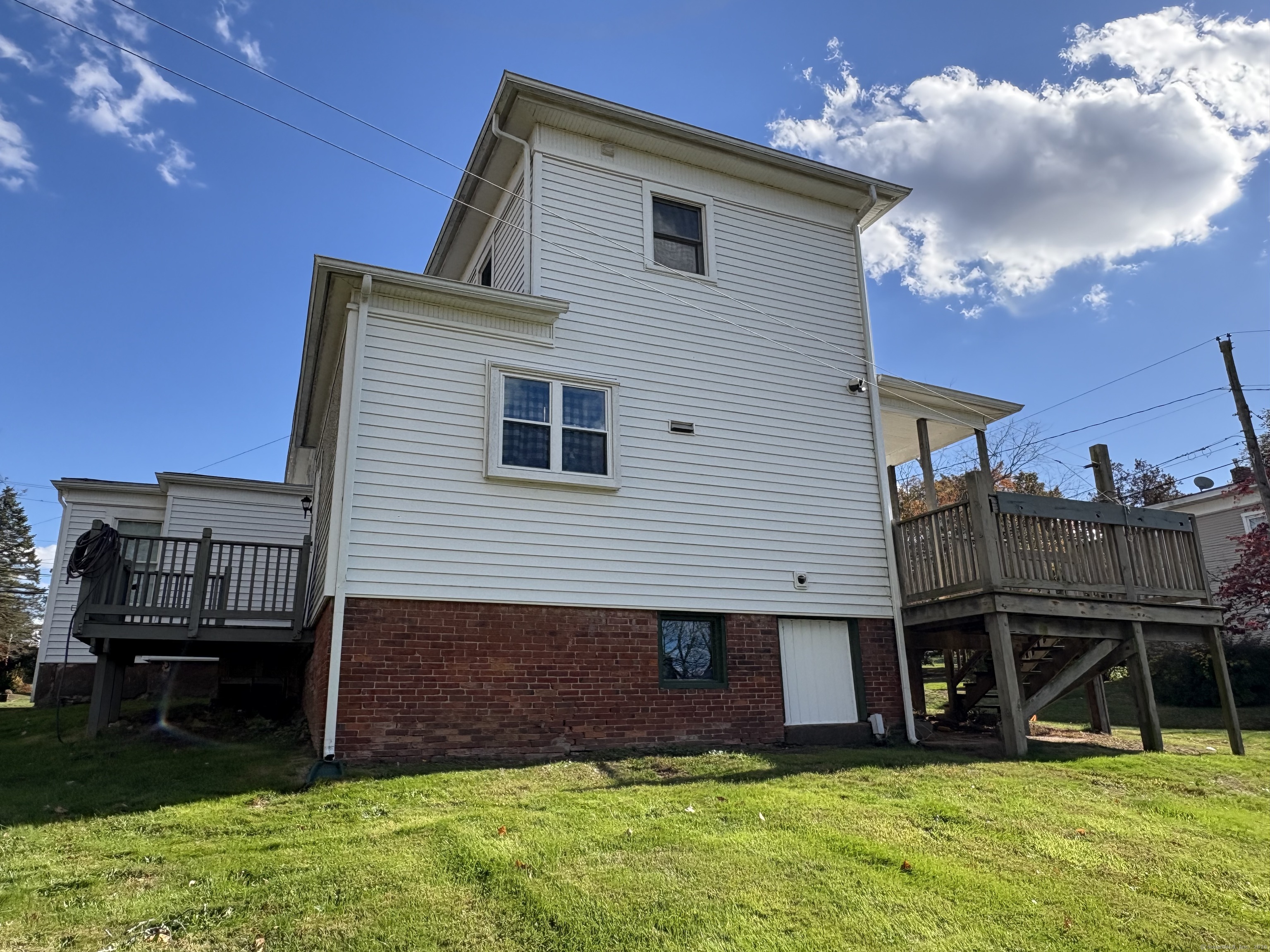 548 Main Street Portland, CT 06480 - Photo 5 of 14 a view of a house with a backyard