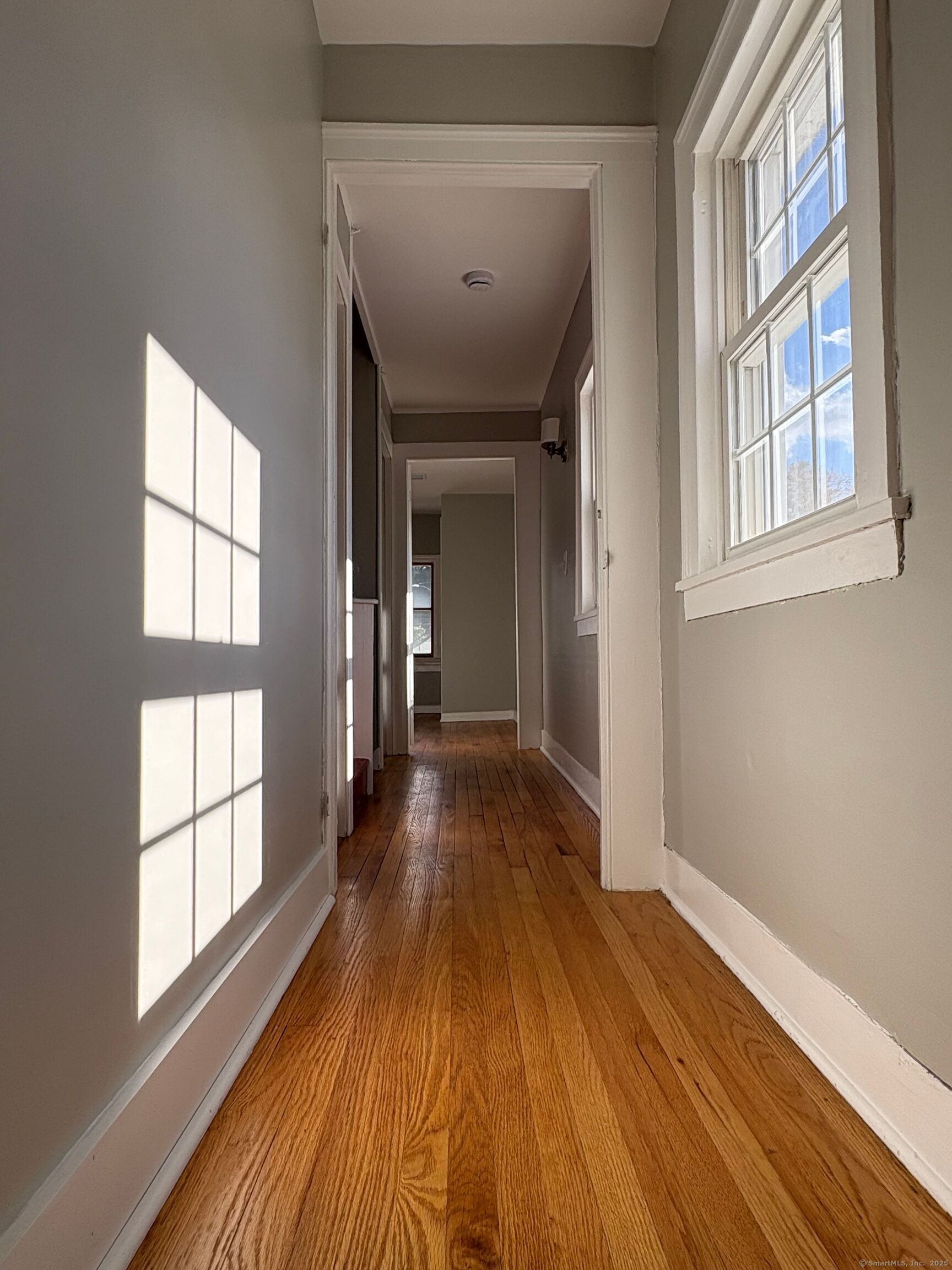 548 Main Street Portland, CT 06480 - Photo 9 of 14 a view of a room with wooden floor and windows