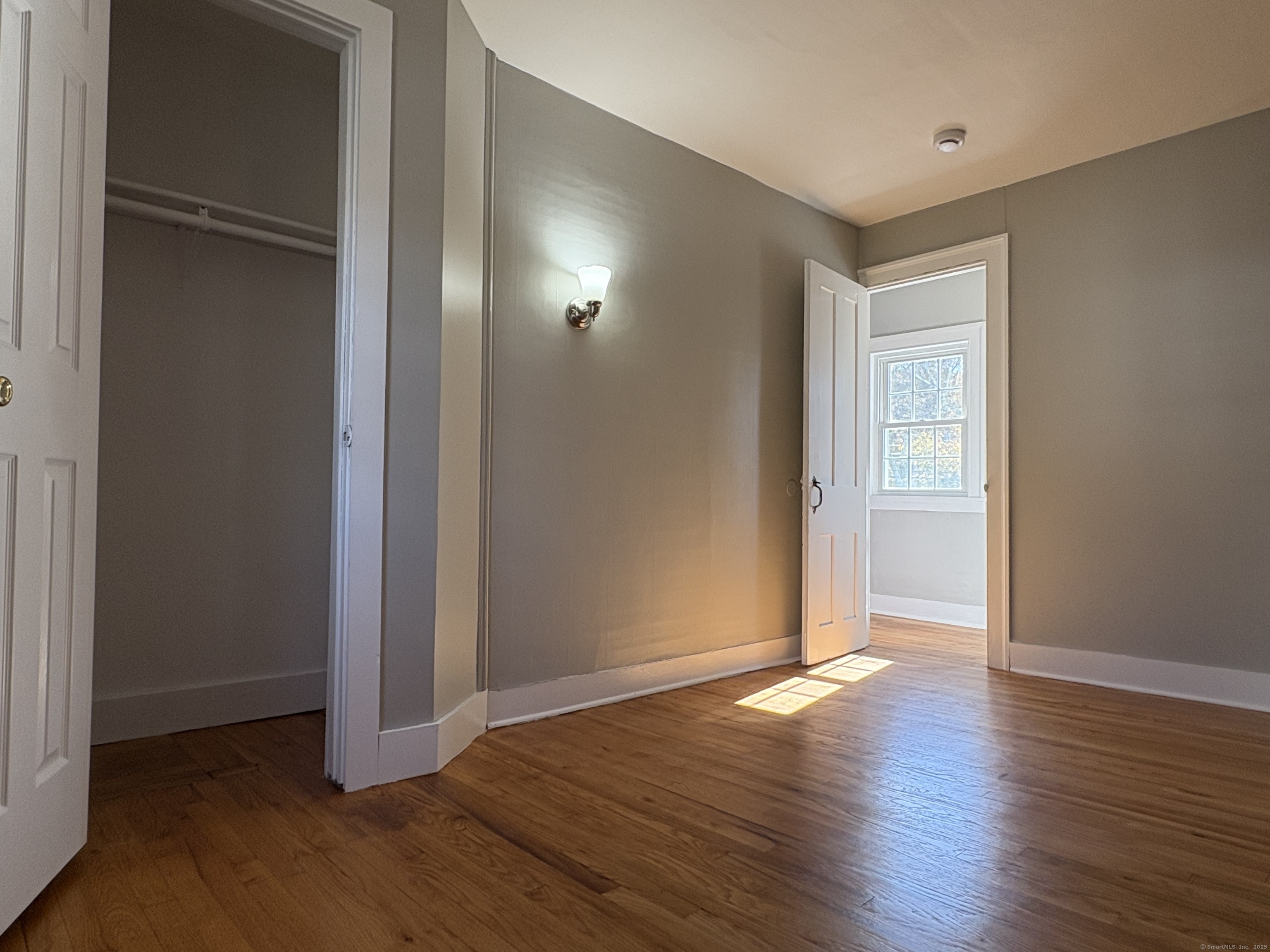 548 Main Street Portland, CT 06480 - Photo 10 of 14 an empty room with wooden floor & closet area