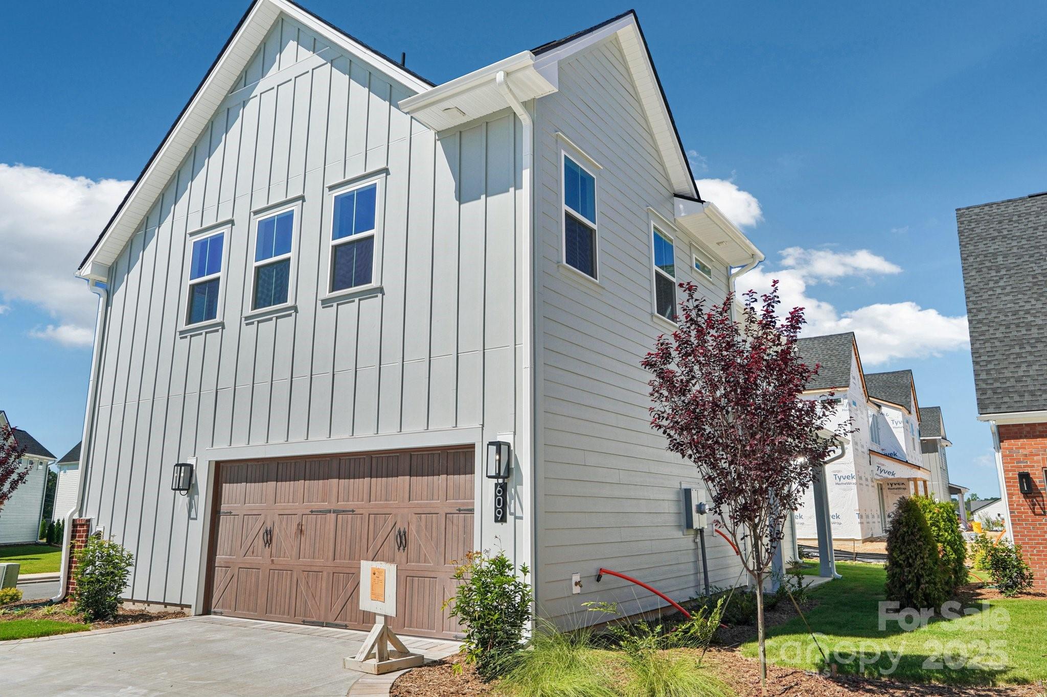 609 Mercury Drive Tega Cay, SC 29708 - Photo 15 of 15 a front view of a house with garden