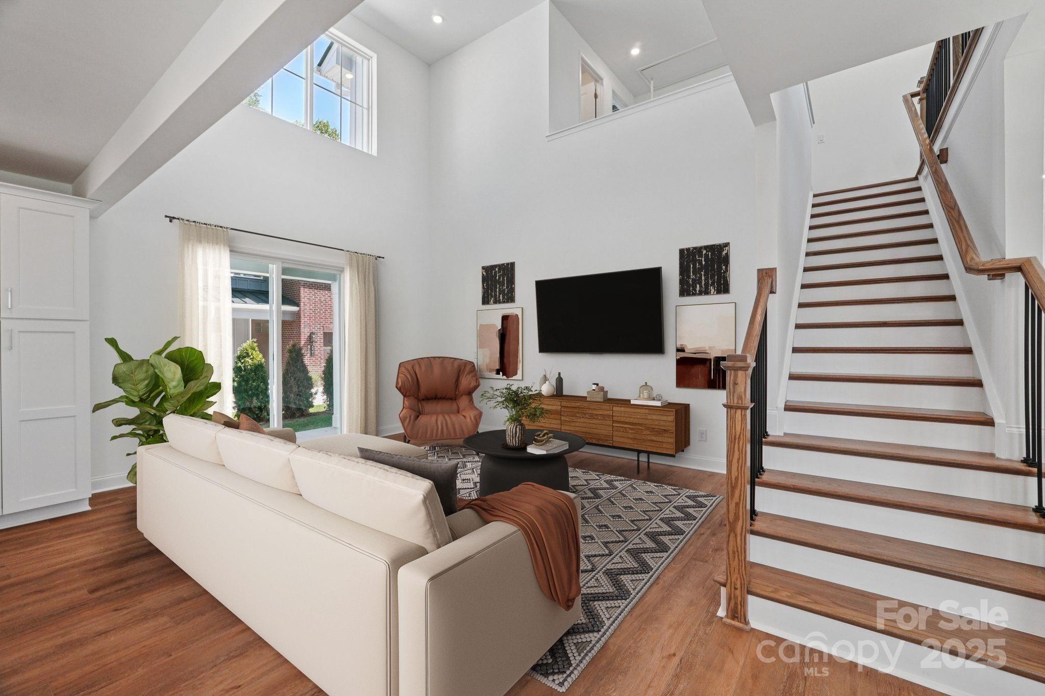 609 Mercury Drive Tega Cay, SC 29708 - Photo 2 of 15 a living room with furniture and a flat screen tv
