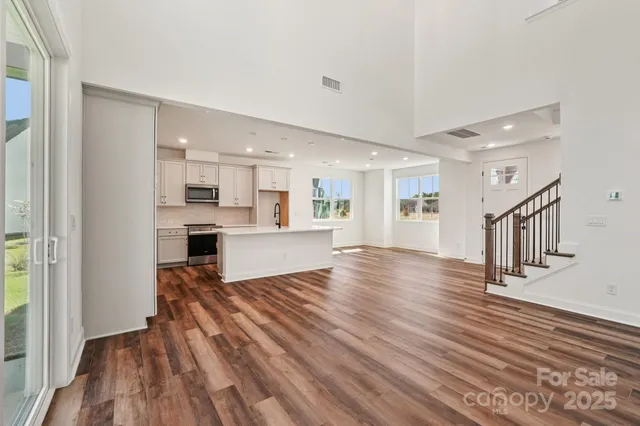a view of kitchen and wooden floor
