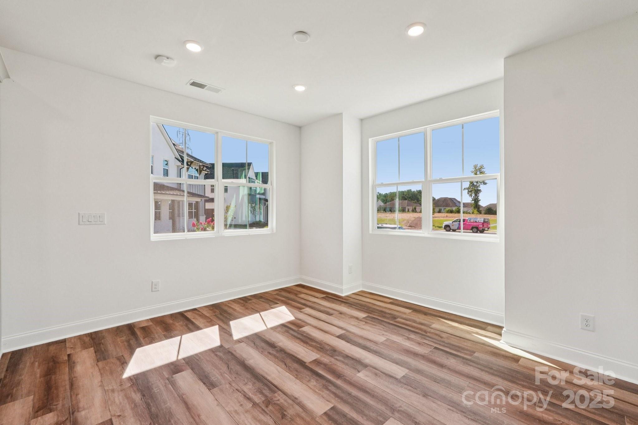 609 Mercury Drive Tega Cay, SC 29708 - Photo 7 of 15 a view of empty room with wooden floor
