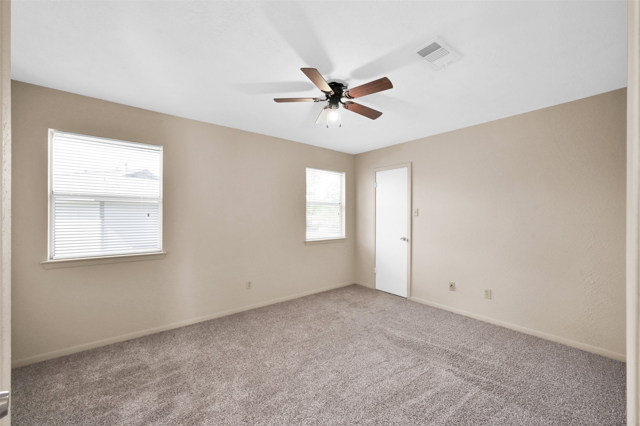 1603 Hazelwood Street, Unit B Conroe, TX 77301 - Photo 14 of 18 a view of an empty room with a window