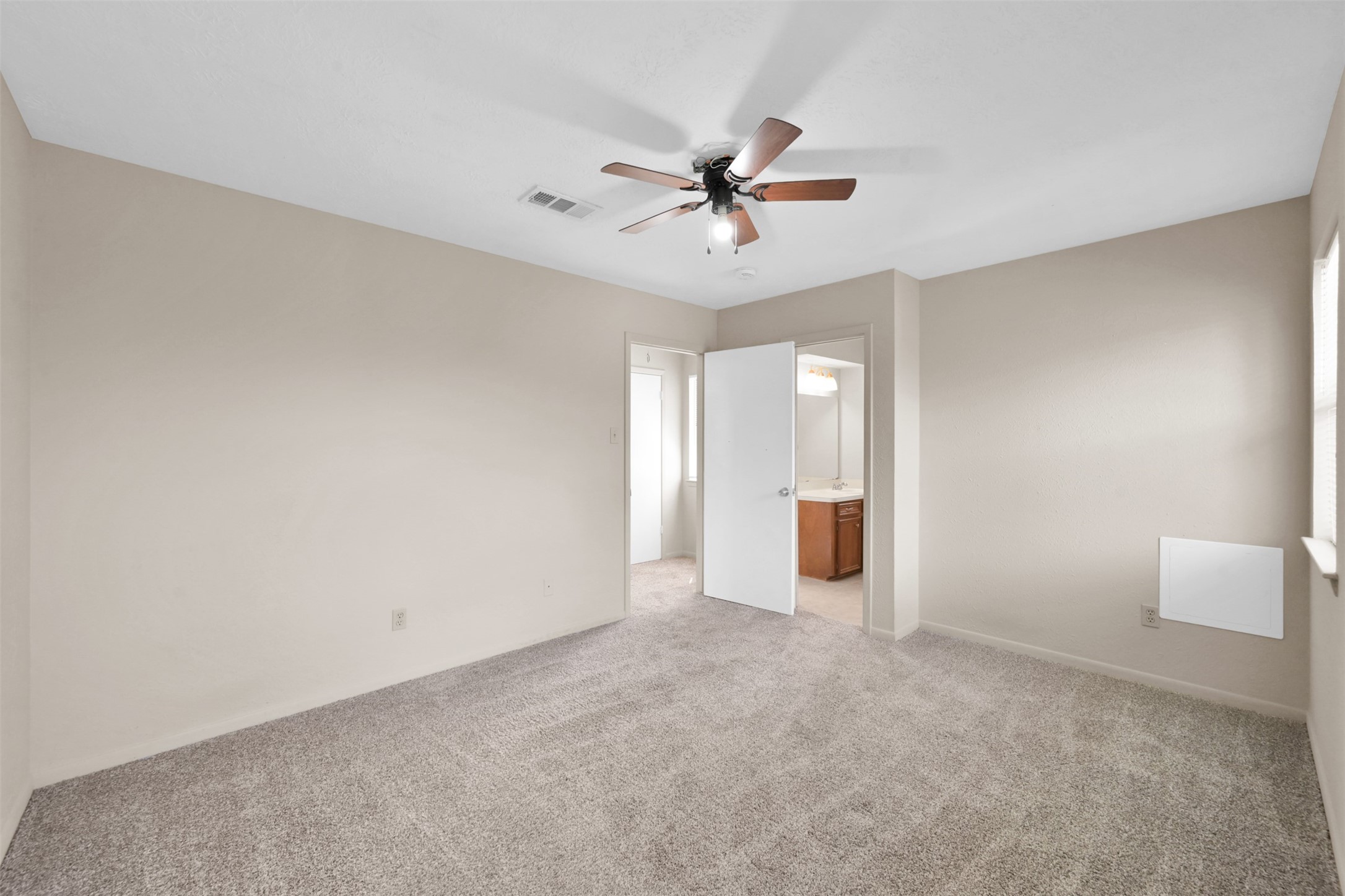 1603 Hazelwood Street, Unit B Conroe, TX 77301 - Photo 15 of 18 a view of a big room with wooden floor and windows in a room