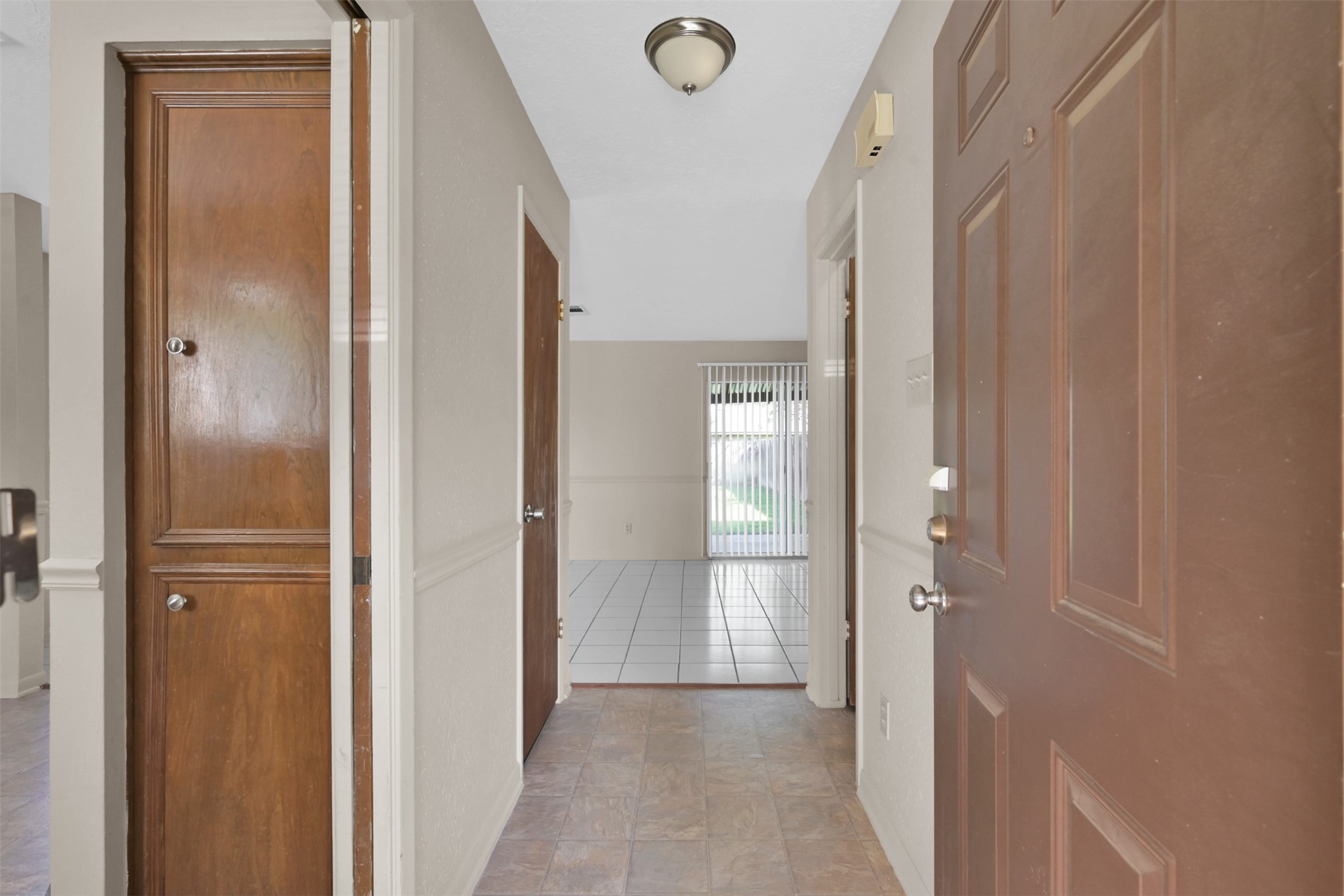 1603 Hazelwood Street, Unit B Conroe, TX 77301 - Photo 3 of 18 a view of a hallway with wooden floor