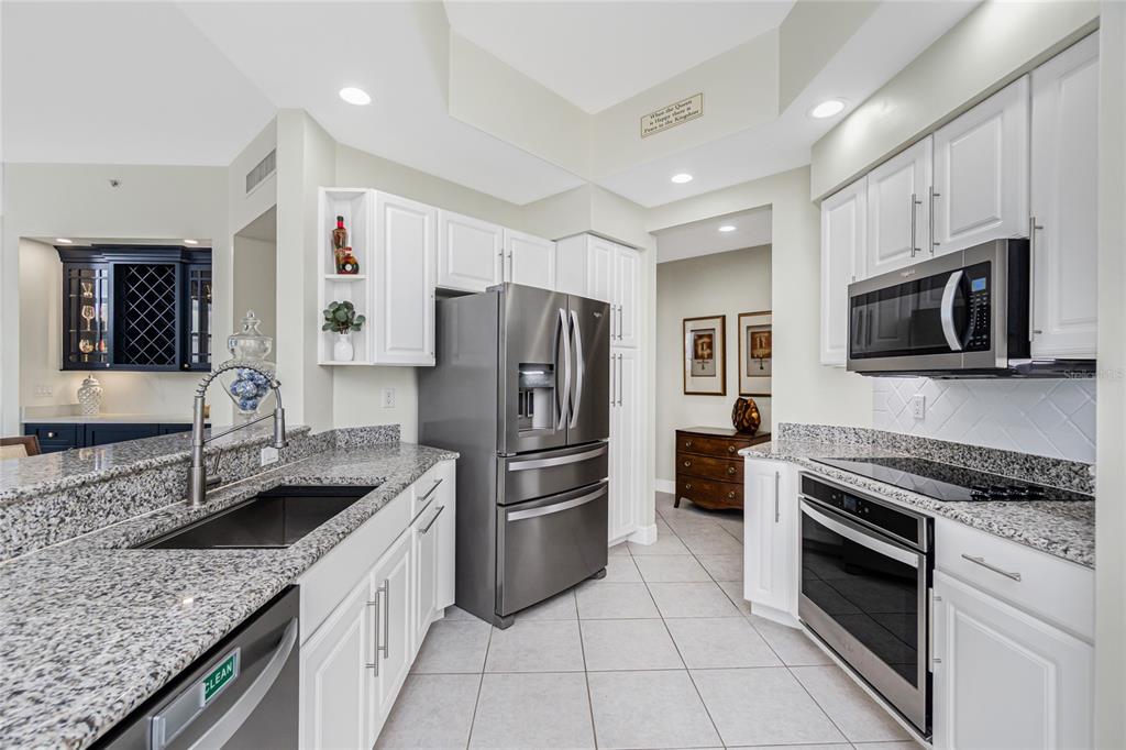 3313 Sunset Key Circle, Unit 701 Punta Gorda, FL 33955 - Photo 20 of 57 a kitchen with granite countertop stainless steel appliances and a sink