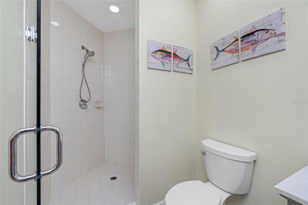 3313 Sunset Key Circle, Unit 701 Punta Gorda, FL 33955 - Photo 28 of 57 a bathroom with a toilet and shower