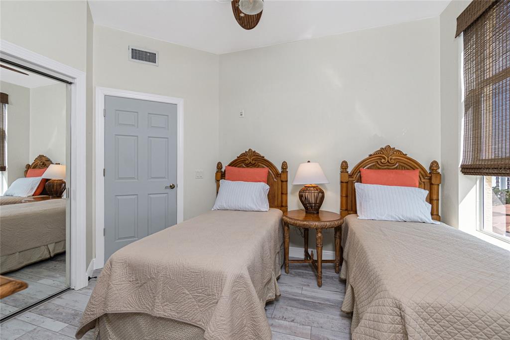 3313 Sunset Key Circle, Unit 701 Punta Gorda, FL 33955 - Photo 32 of 57 a bedroom with a bed and dresser