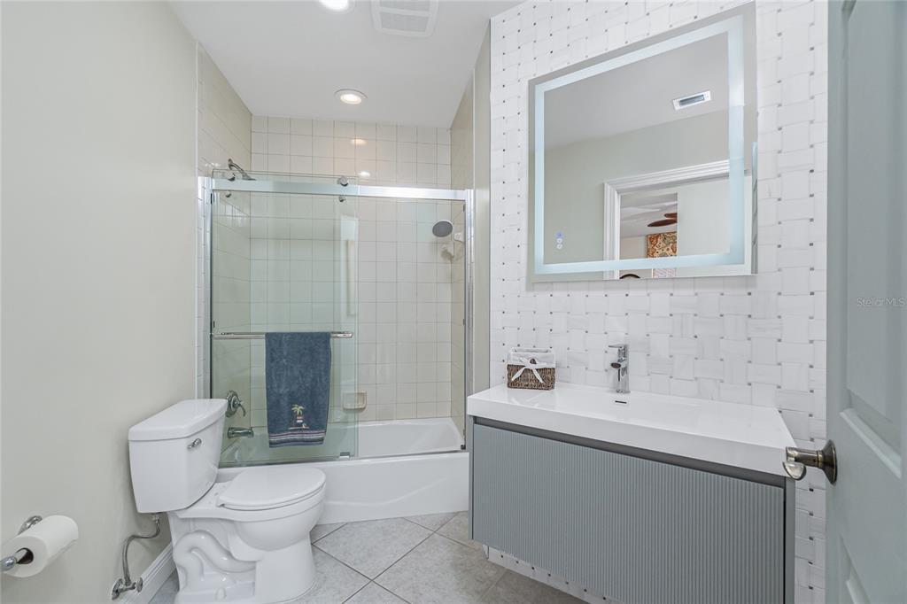 3313 Sunset Key Circle, Unit 701 Punta Gorda, FL 33955 - Photo 33 of 57 a bathroom with a sink toilet and shower