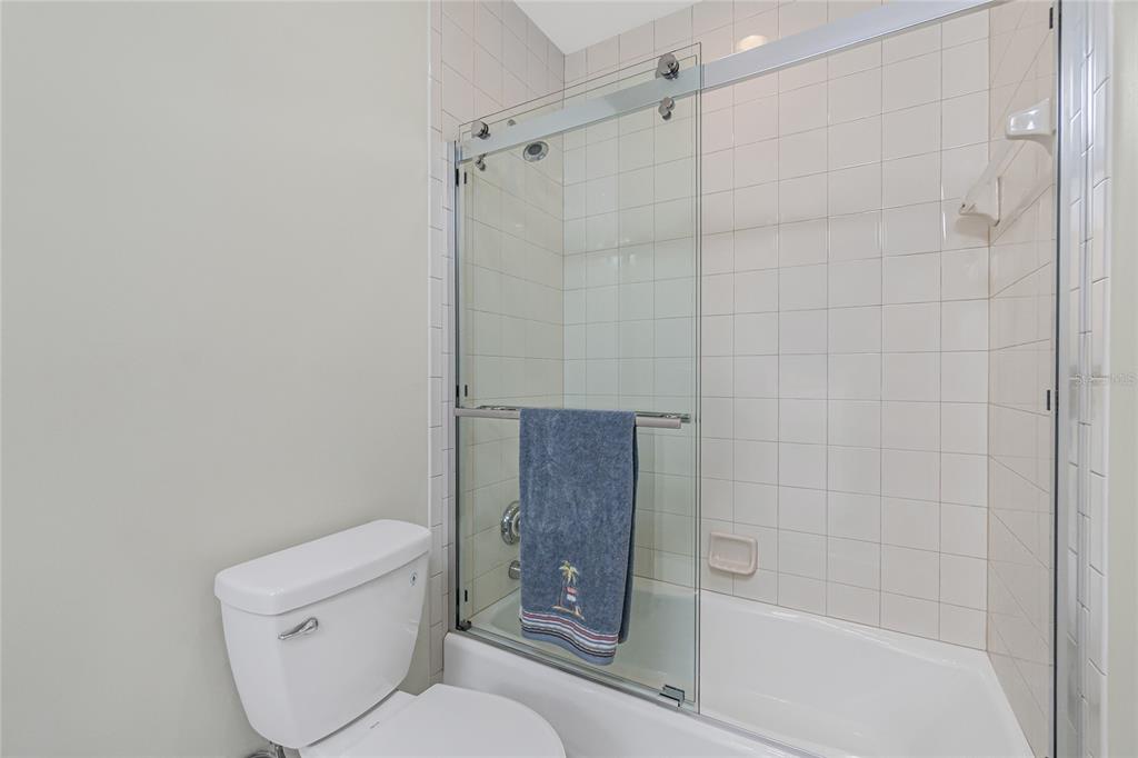 3313 Sunset Key Circle, Unit 701 Punta Gorda, FL 33955 - Photo 34 of 57 a bathroom with a toilet and shower