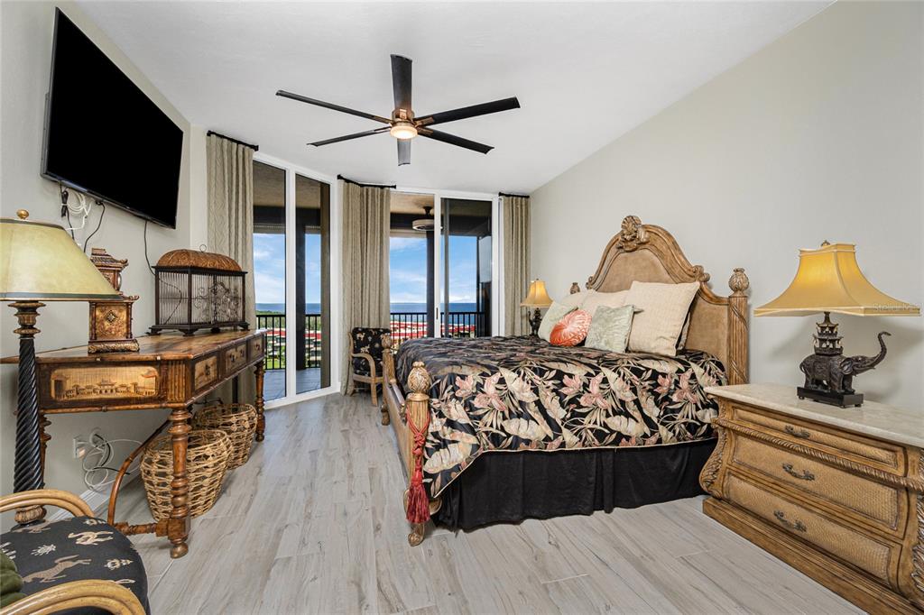 3313 Sunset Key Circle, Unit 701 Punta Gorda, FL 33955 - Photo 41 of 57 a bedroom with a bed a flat screen tv and dresser