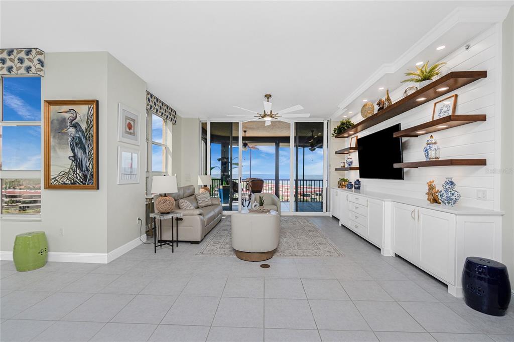 3313 Sunset Key Circle, Unit 701 Punta Gorda, FL 33955 - Photo 5 of 57 a living room with furniture and a flat screen tv