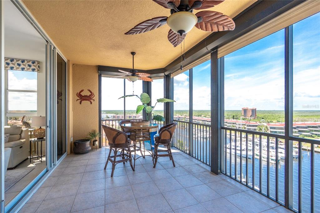 3313 Sunset Key Circle, Unit 701 Punta Gorda, FL 33955 - Photo 51 of 57 a view of a dining room with furniture window and outside view