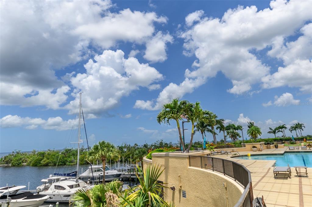 3313 Sunset Key Circle, Unit 701 Punta Gorda, FL 33955 - Photo 57 of 57 a view of a lake with a table and chairs