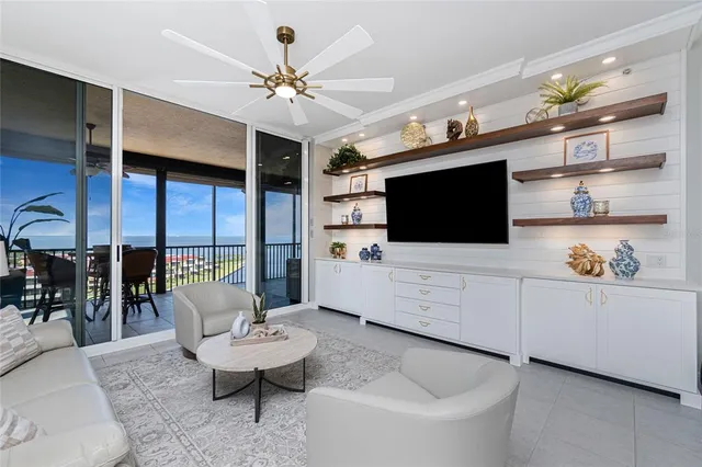 a kitchen with stainless steel appliances kitchen island granite countertop a refrigerator and a stove top oven