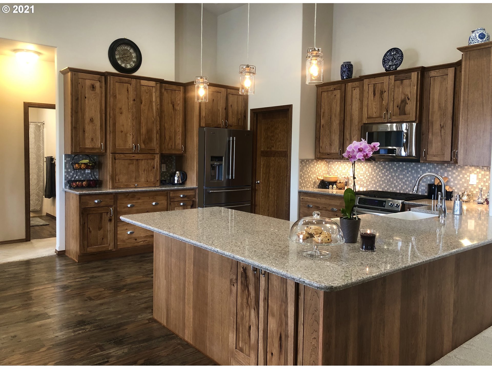 1304 Alpha Court Pendleton, OR 97801 - Photo 11 of 32 a kitchen with stainless steel appliances granite countertop a sink refrigerator and cabinets